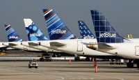 a group of airplanes parked on a runway