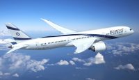 a white airplane flying in the sky
