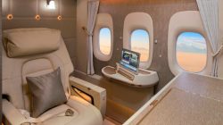 a laptop on a table in an airplane