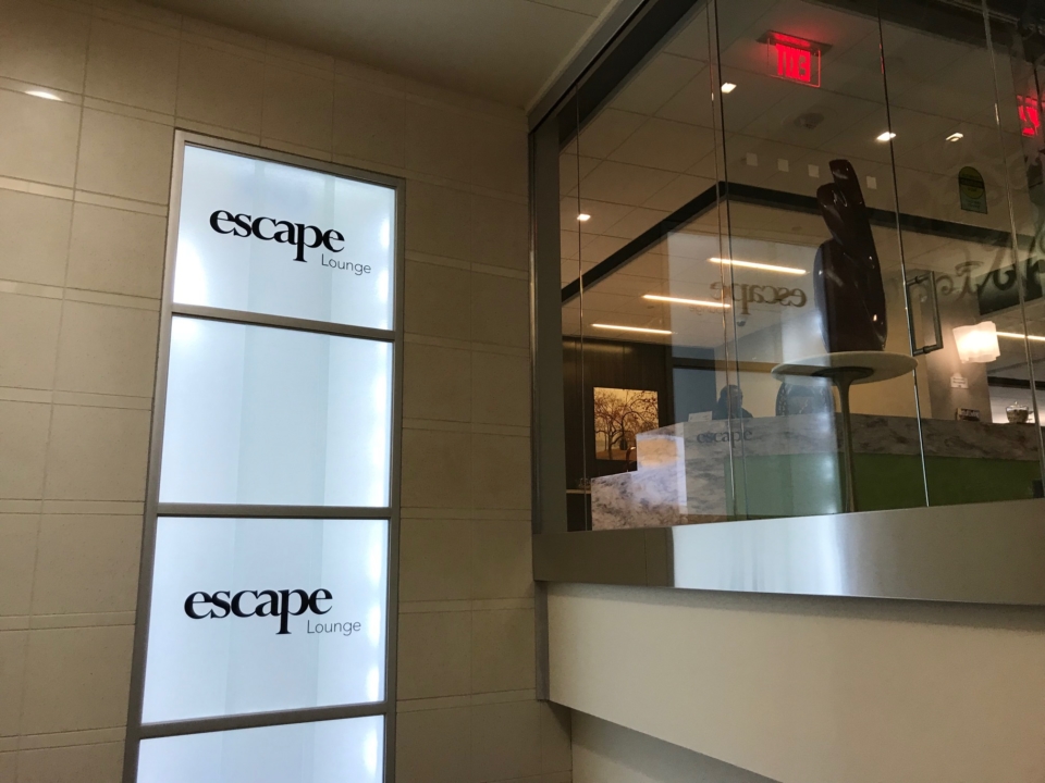 a glass wall with a sign on it