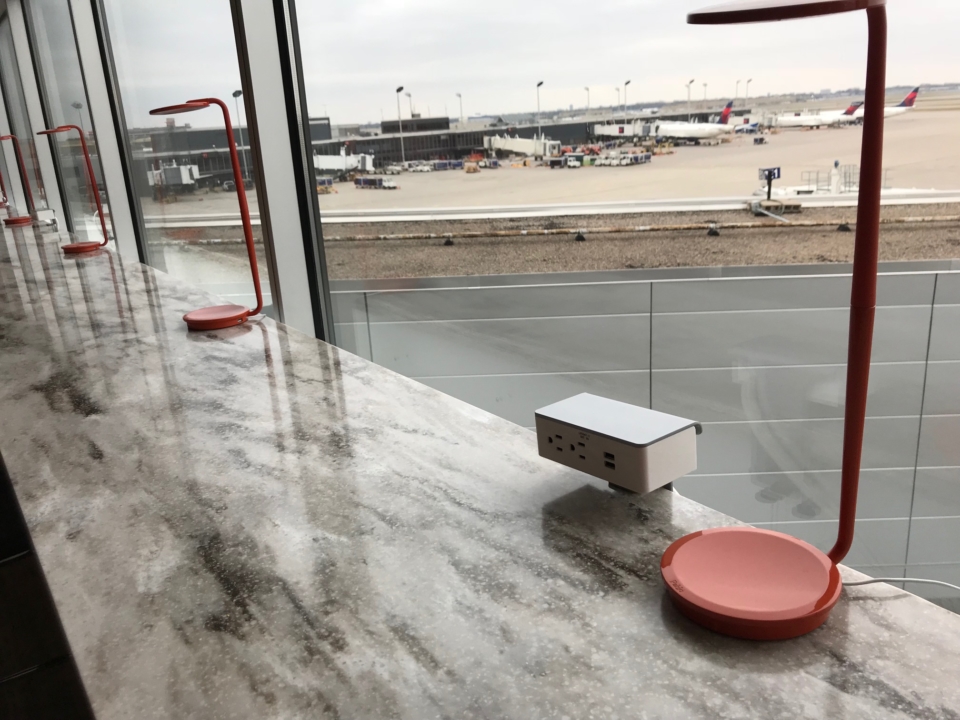 a table with red lamps and a power outlet
