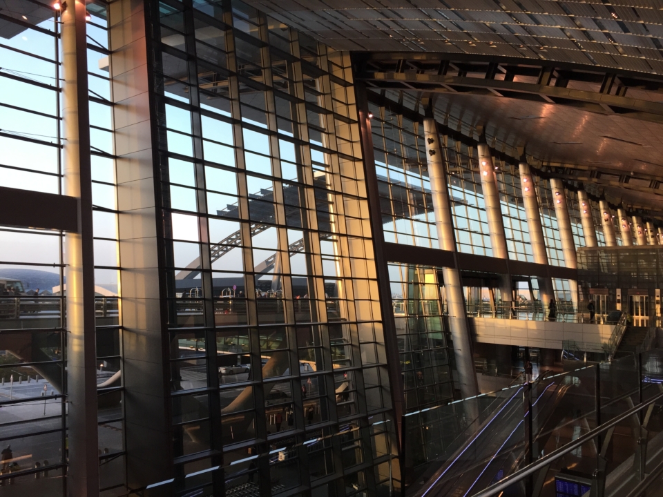 a large glass building with a staircase