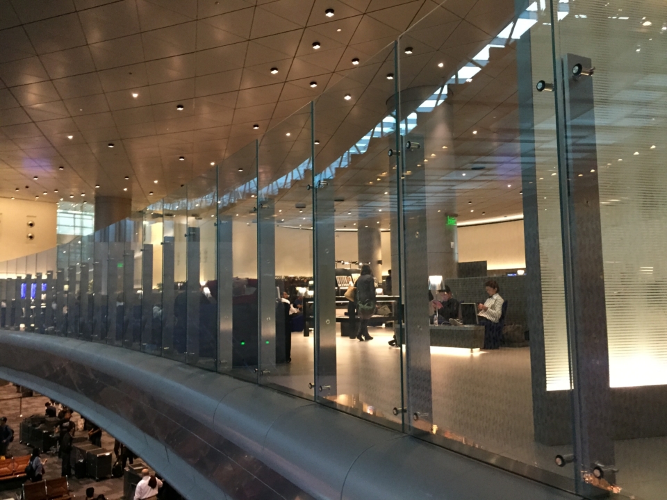 a glass wall with people in it