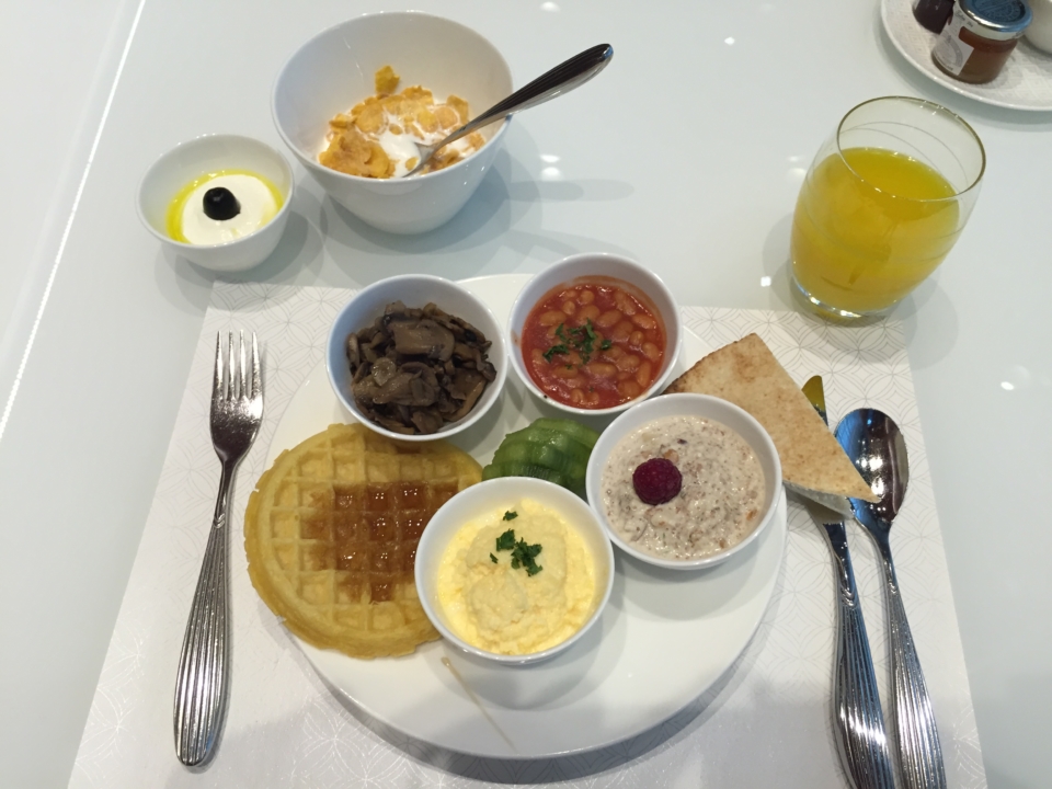 a plate of food with spoons and fork