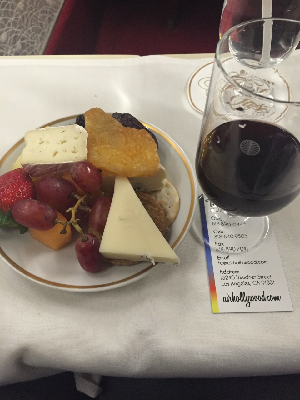 a plate of food and a glass of wine
