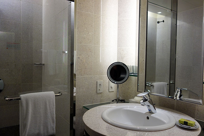 a bathroom with a mirror and sink