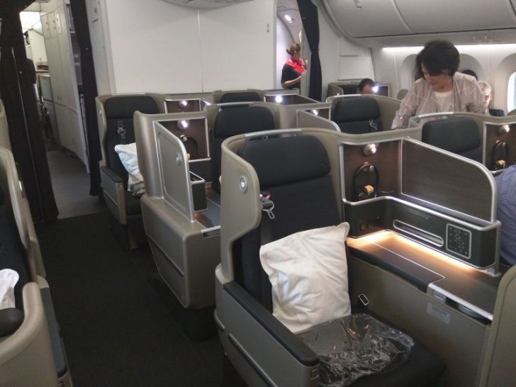 a woman in a chair in an airplane