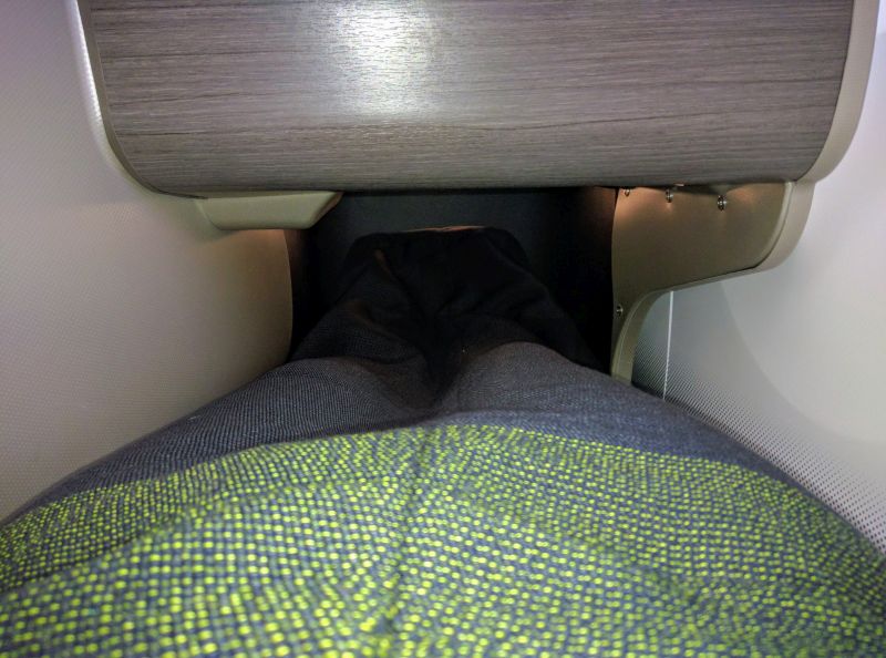 a person's leg in a seat