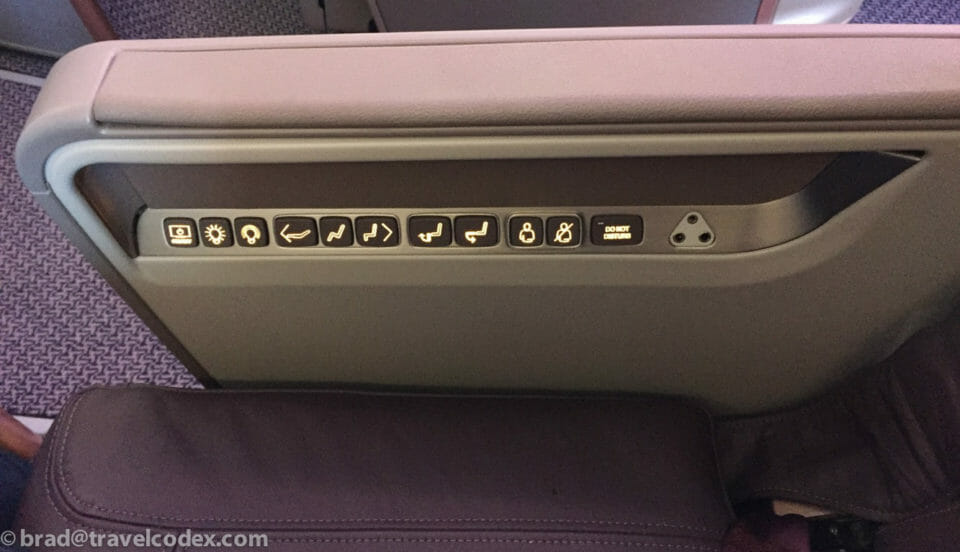 a seat with buttons and lights