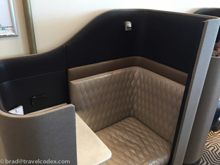 a booth with a table and a lamp