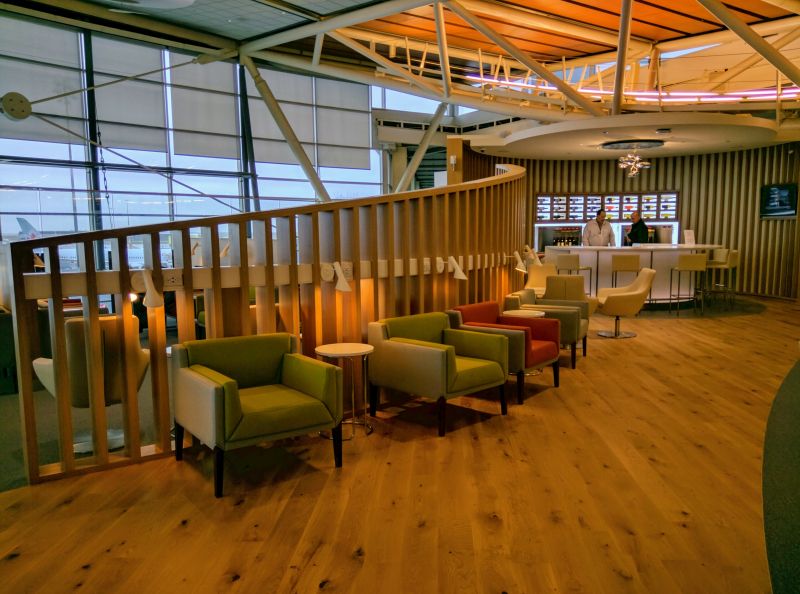 a room with a staircase and chairs