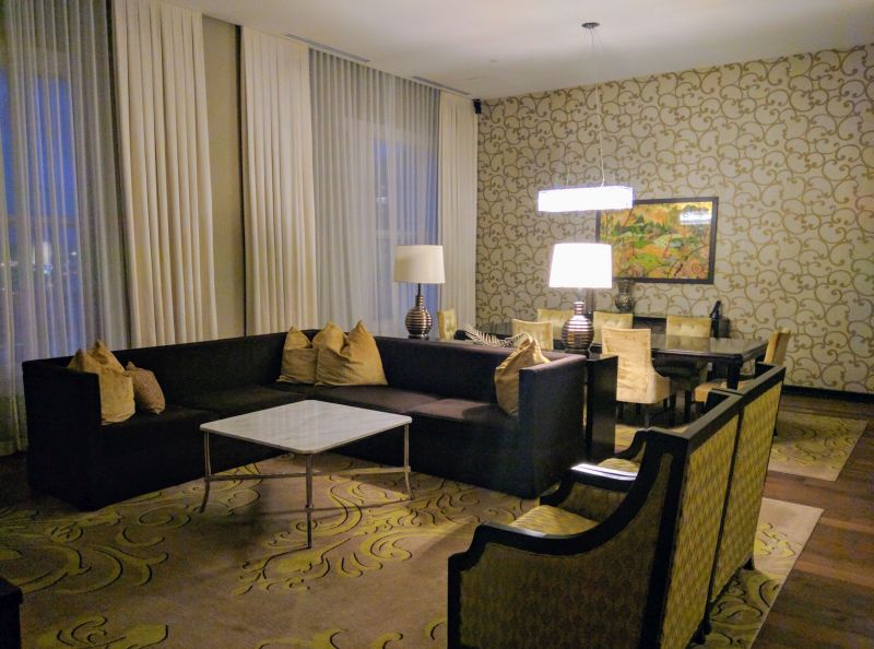 a living room with a couch and chairs