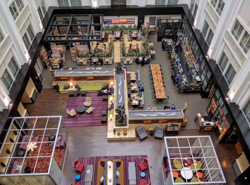 a large building with tables and chairs