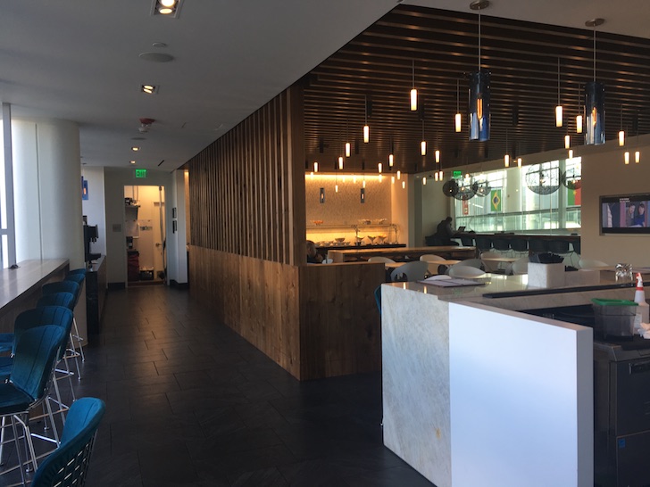 a restaurant with a counter and chairs
