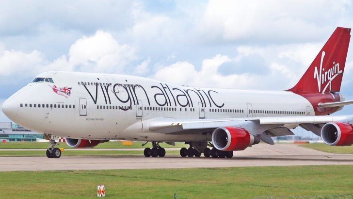 a large white airplane on a runway