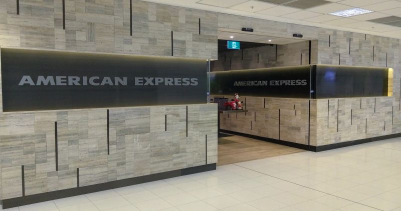 a reception area with a sign