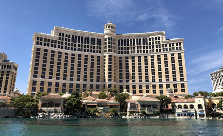 a large building with many windows with Bellagio in the background