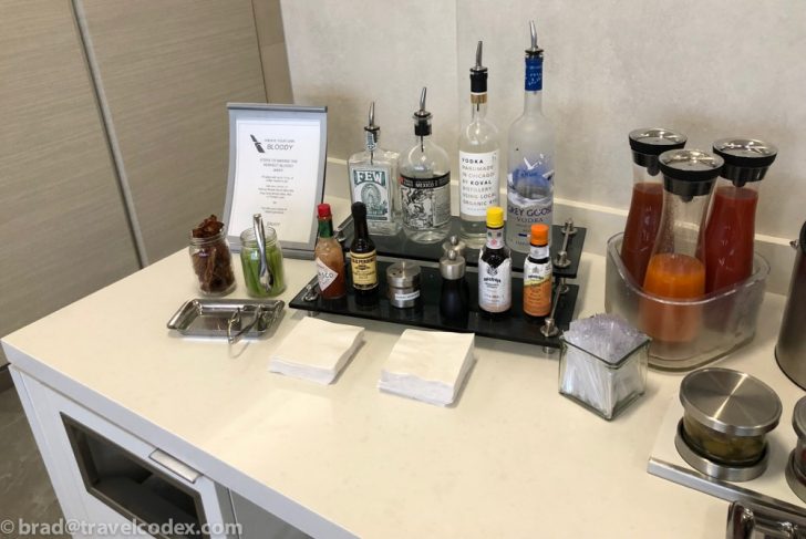 a table with various bottles and condiments
