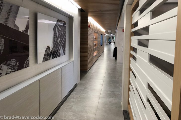 a hallway with a picture on the wall