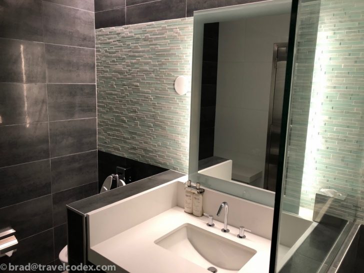 a bathroom with a mirror and sink