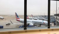 a group of airplanes in an airport