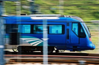 a blue train on the tracks