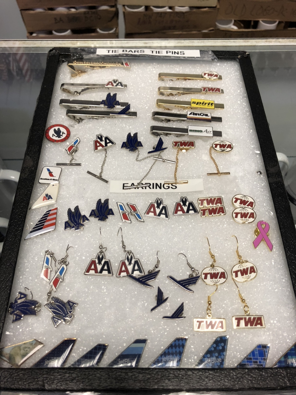 a display of earrings and pins