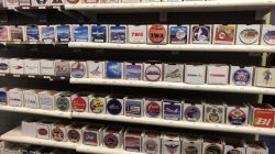 a group of small square shaped stickers on a shelf