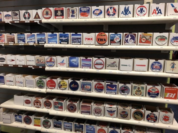 a group of small square shaped stickers on a shelf