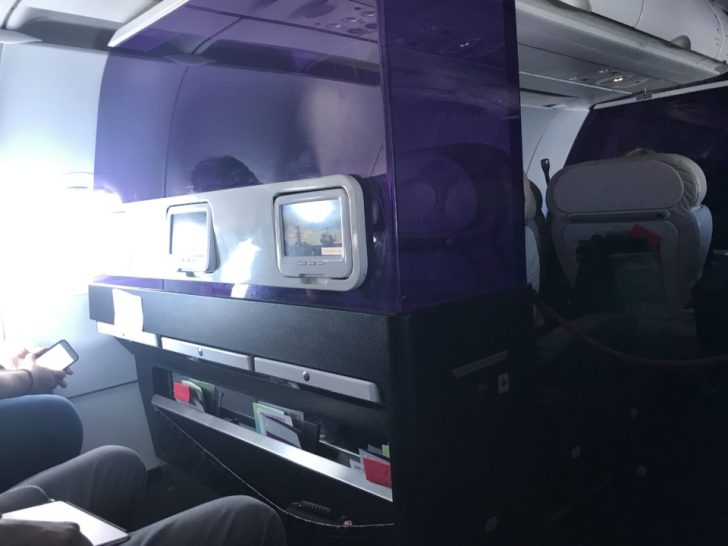 a room with a screen on the side