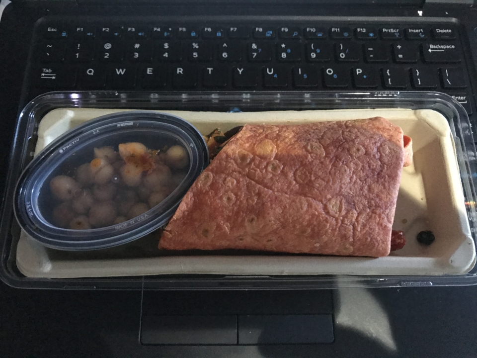a burrito and beans in a container