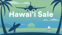 a man holding a surfboard and a plane flying over the water