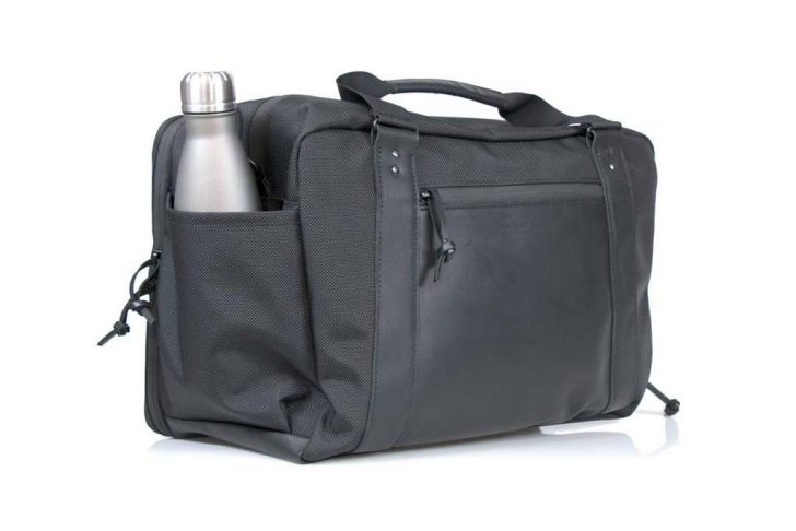 a black bag with a bottle in it