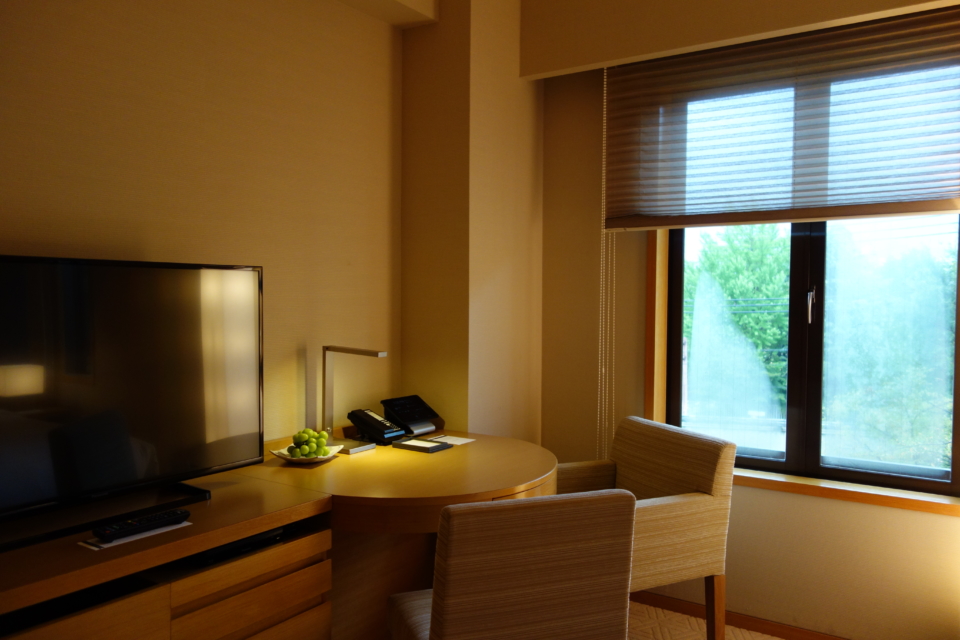 a room with a television and chair