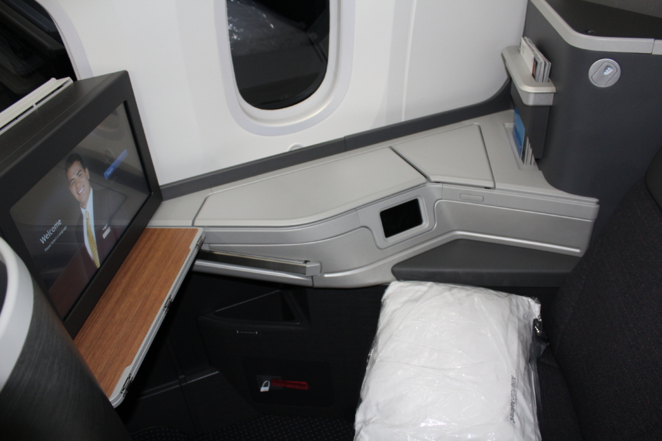 a seat and window in an airplane