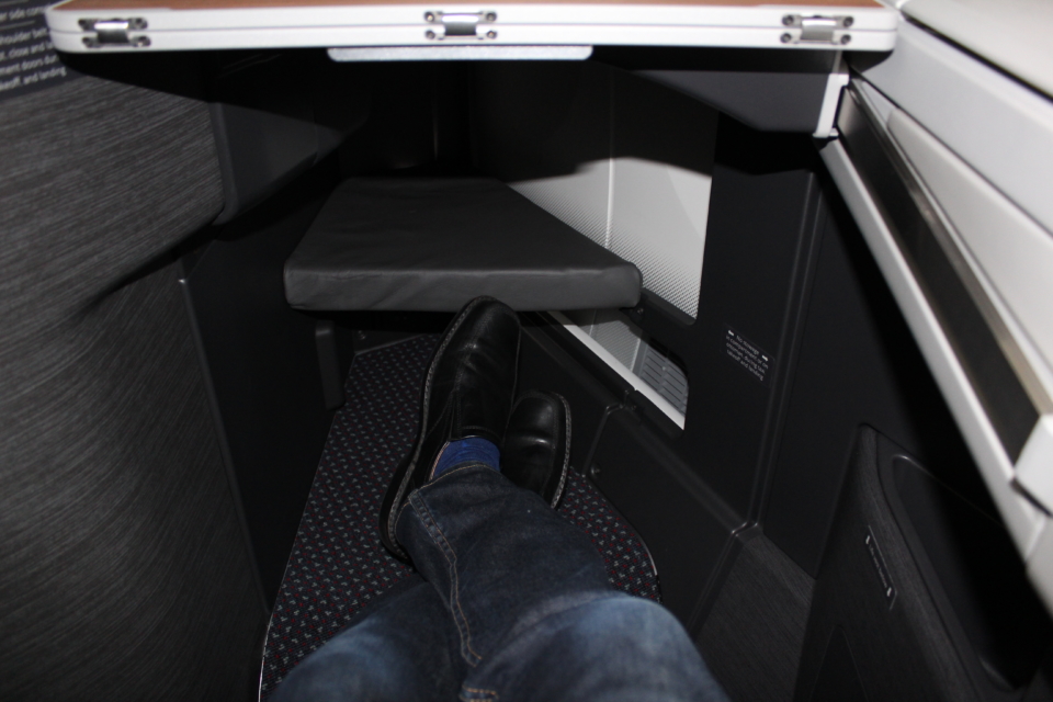 a person's legs in a chair