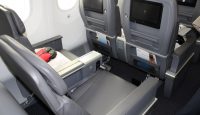 a seat with a monitor on the back