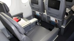 a seat with a monitor on the back
