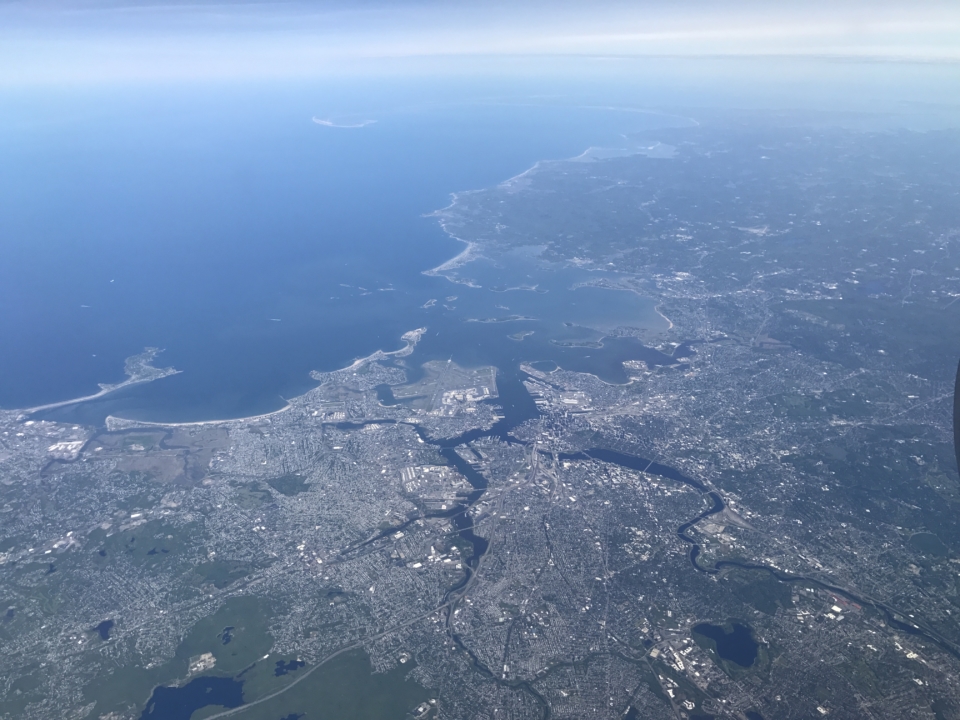an aerial view of a city and water