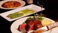 a plate of food with a knife and fork