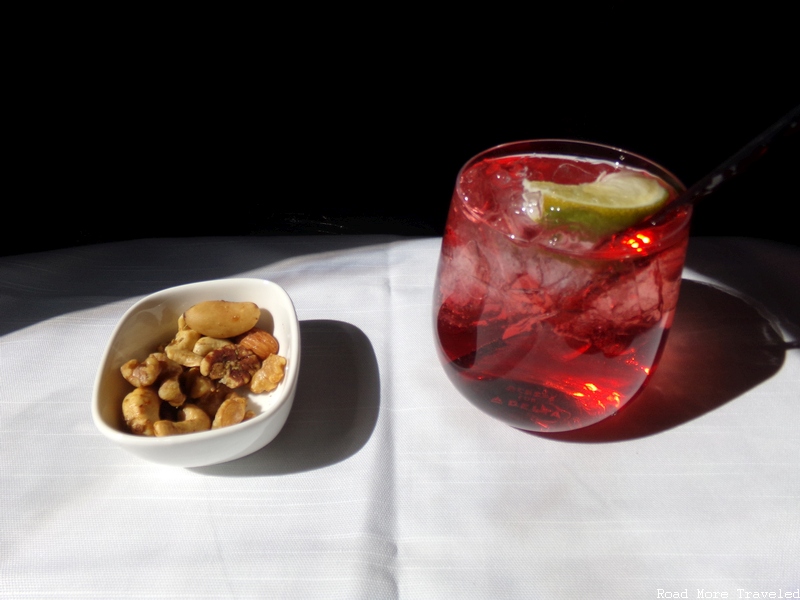 Delta One - mixed nuts and Delta Sunrise cocktail