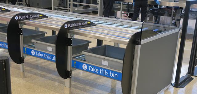 a conveyor belt with a bin