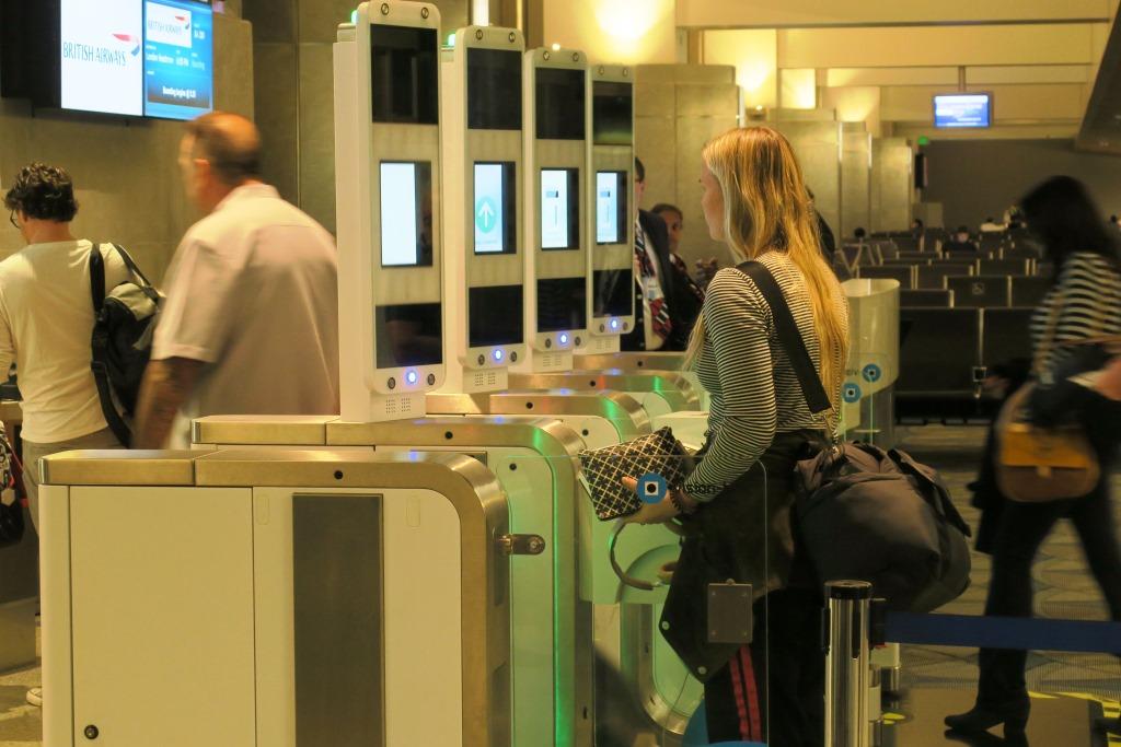 a woman standing in front of a machine