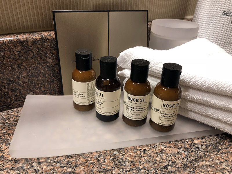 a group of small bottles with white labels on a counter
