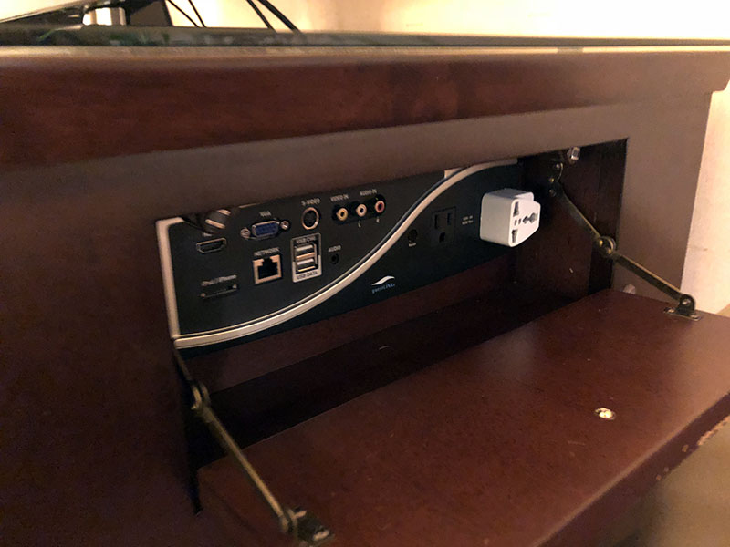 a computer console with a power outlet