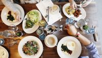 a group of people eating at a table