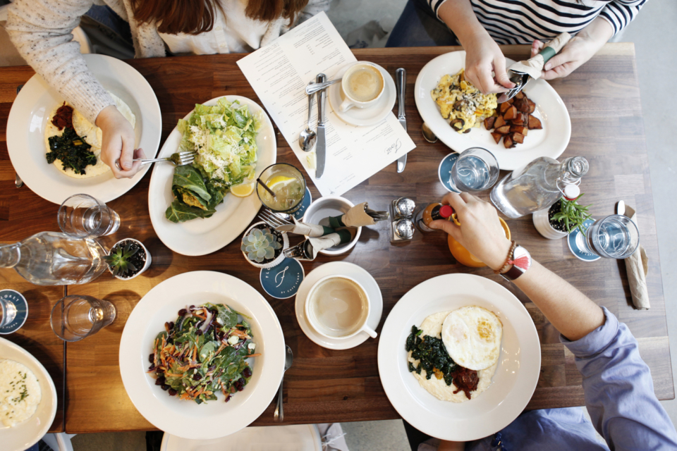 a group of people eating at a table