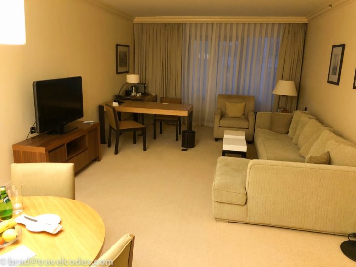 a living room with a television and couches