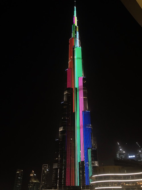 a tall building with colorful lights