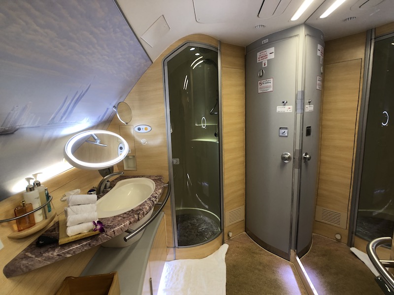 a bathroom with a shower and sink
